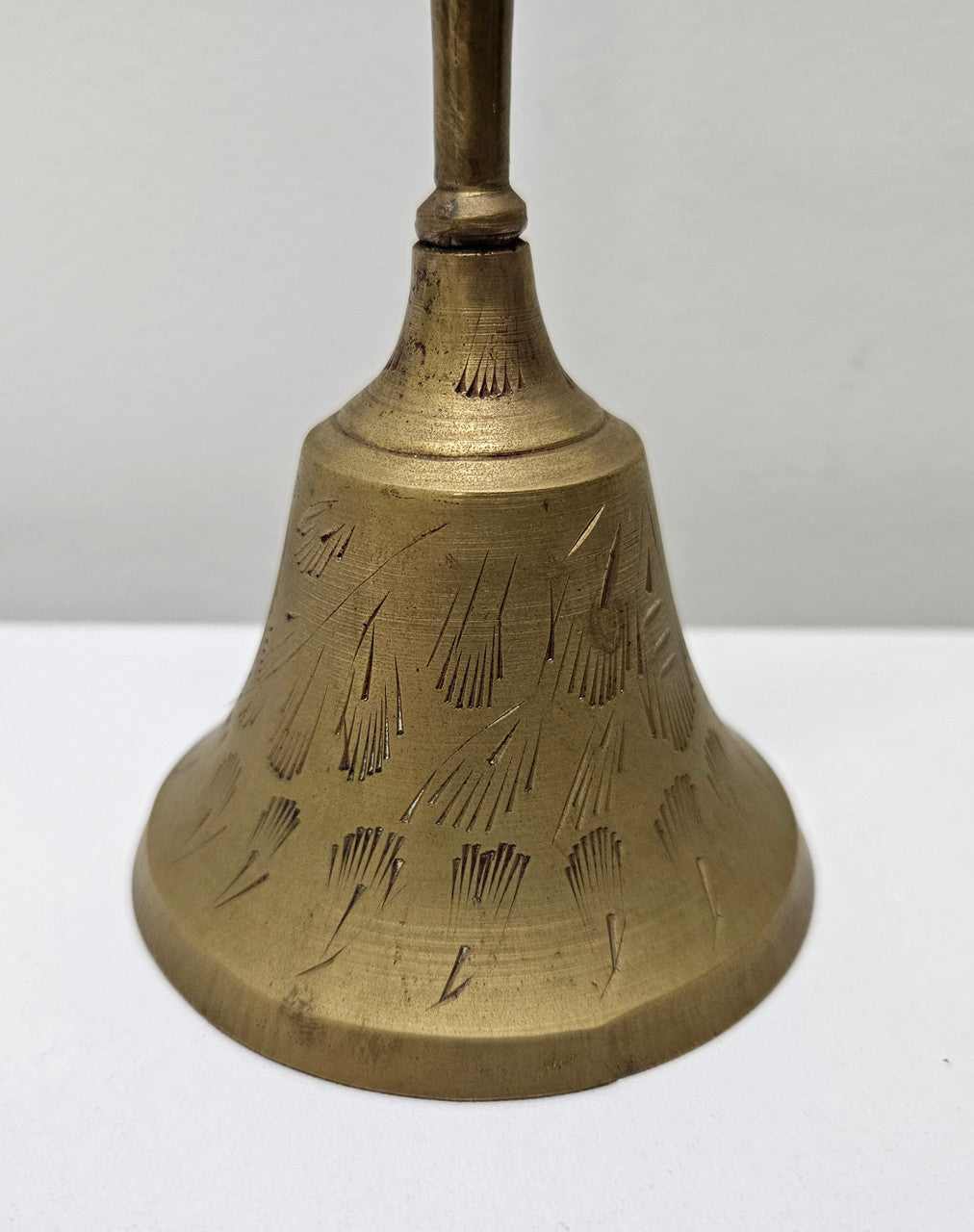 Vintage brass bell with engraved lines and markings on the insde. Please see photos as they form part of the description. In good original condition.