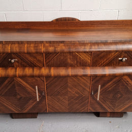 Vintage Walnut Art Deco “Waterfall” sideboard buffet with two drawers and two doors. It is in good original condition and has been sourced locally.
