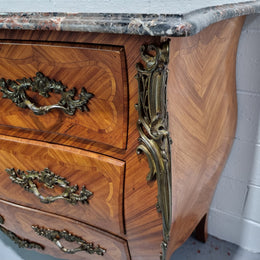 Attractive French marble top Louis XV style three drawer commode with decorative ormolu mounts. In good original detailed condition.