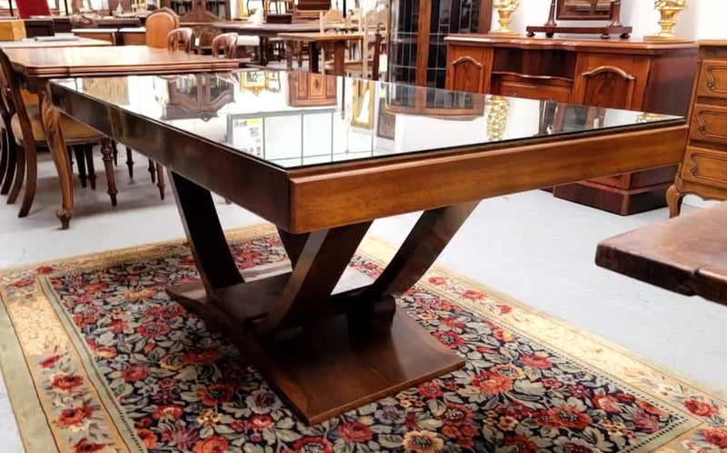 French Art Deco Figured Walnut dining table and six chairs. This stylish table also comes with a glass top and can be used with or without it. The chairs are very comfortable and the table can also fit another two chairs at either end making it a 6-8 seater. The table is in good original detailed condition with character marks to the top of table as shown in the pictures. This table and six chairs have been sourced locally.