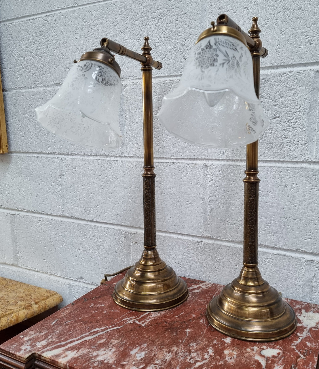 Pair of tall Antique style table lamps with glass floral etched shades. They have been sourced locally and are in good original detailed working condition.