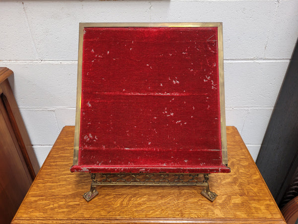 Antique French brass Gothic Revival book stand with red velvet. It has sourced from France and is in good original condition.