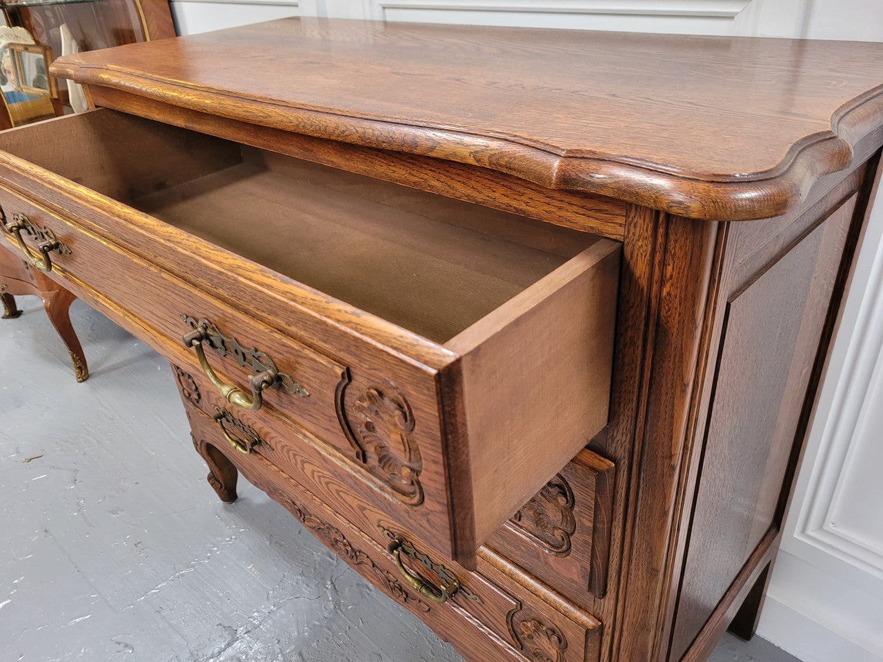 French Louis XV style Oak three drawer chest with wooden top. It has been sourced from France and is in good original detailed condition.