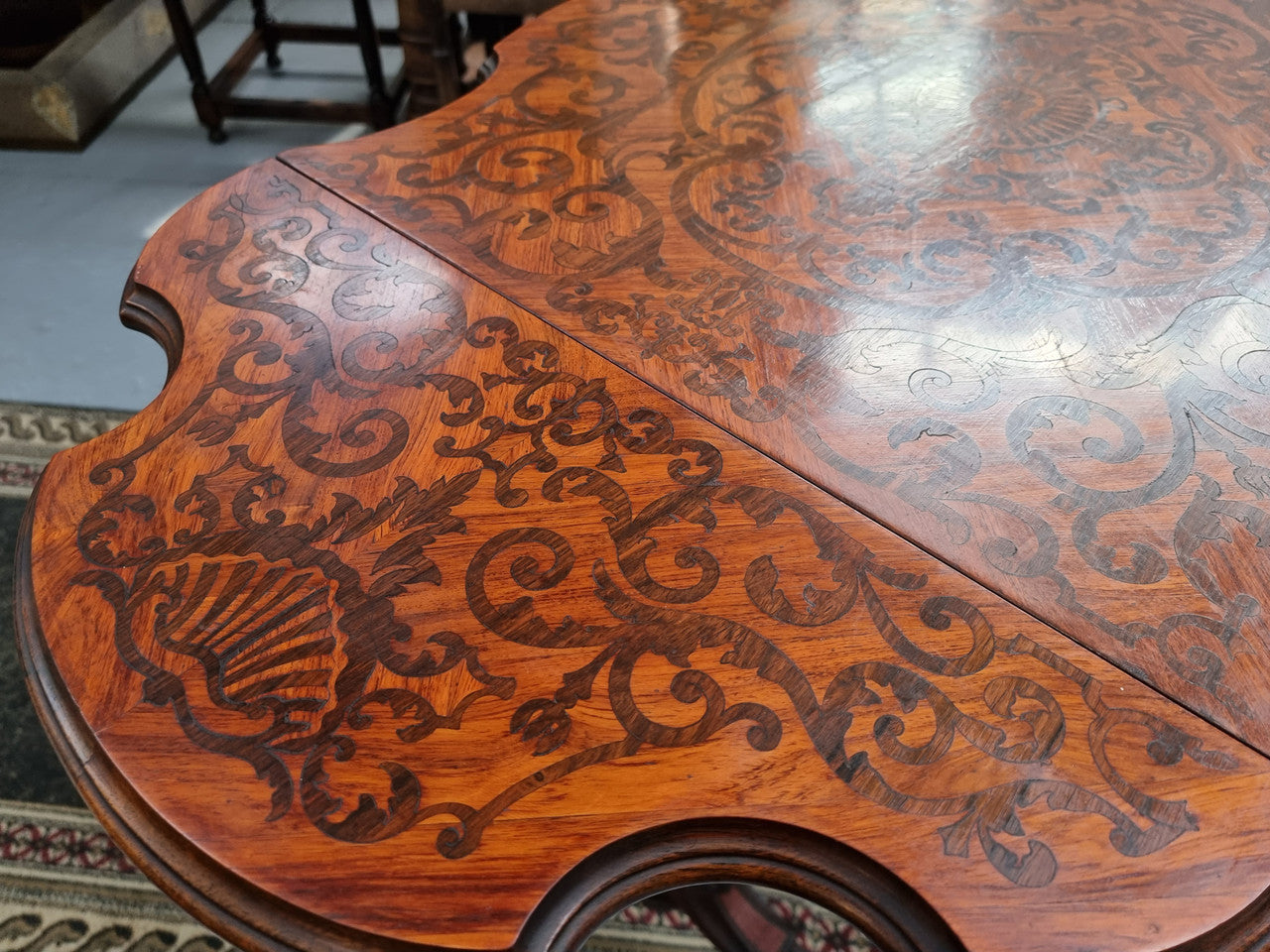 Fabulous marquetry inlaid side table with marquetry extensions and one drawer. Stunning side table or small ladies desk.