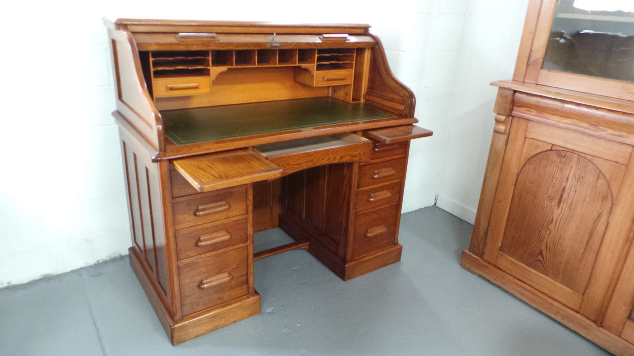 An Antique English Oak Roll Top Desk