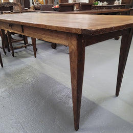 Provincial 19th Century French Oak rustic farmhouse table with tapered leg and single drawer. It has been sourced from France and is in good original detailed condition. 