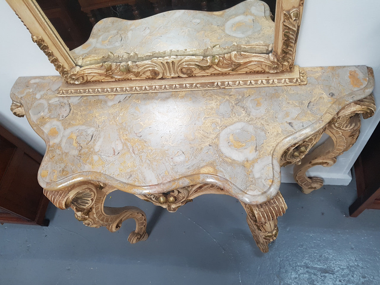 Beautifully carved Italian Rococo style painted console/hall table and mirror. An amazing coloured marble top showing sections of gold veins and is in good condition. Mantle mirror is retaining it's original mirror and showing ages spots.
