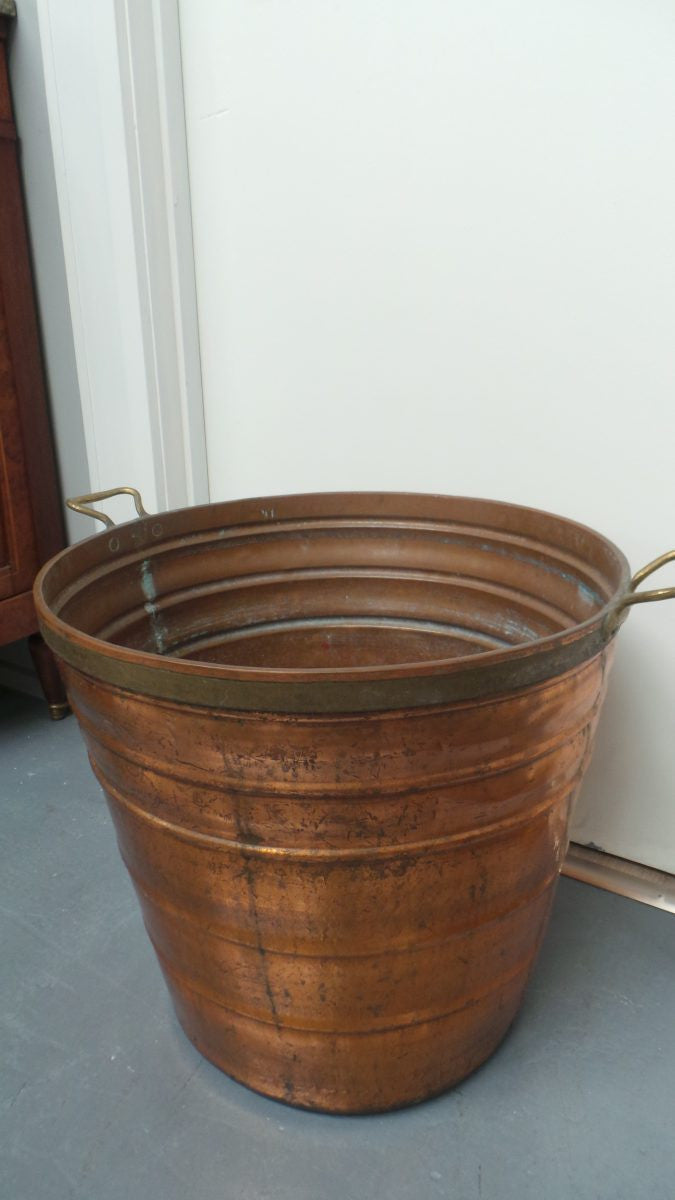 A fabulous French rustic antique copper and brass two handled bucket. Has loads of character and would make a great bucket for firewood. It is in very good original condition