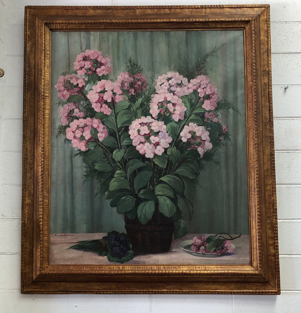 Lovely signed French framed oil on canvas painting of Hydrangeas in a lovely gilt frame. It is in good original condition.