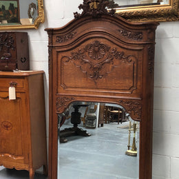 Antique French Oak Louis XV style mantle/trumeau mirror. It has its original mirror and is in good original detailed condition.