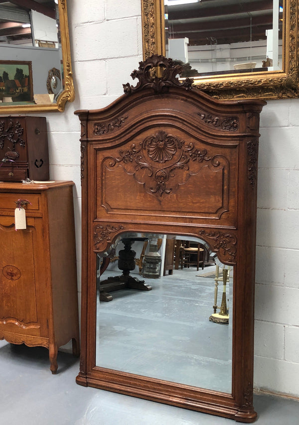 Antique French Oak Louis XV style mantle/trumeau mirror. It has its original mirror and is in good original detailed condition.