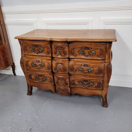French Antique Louis XIV style Oak wooden top commode. It has a stunning serpentine bombe shape front along with amazing handles and carvings. It comes with three beautiful keys as pictured and comes with working locks. It has been sourced from France and in good original detailed condition.