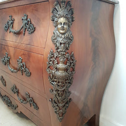 A Grand French Louis XV Style Flame Mahogany Commode