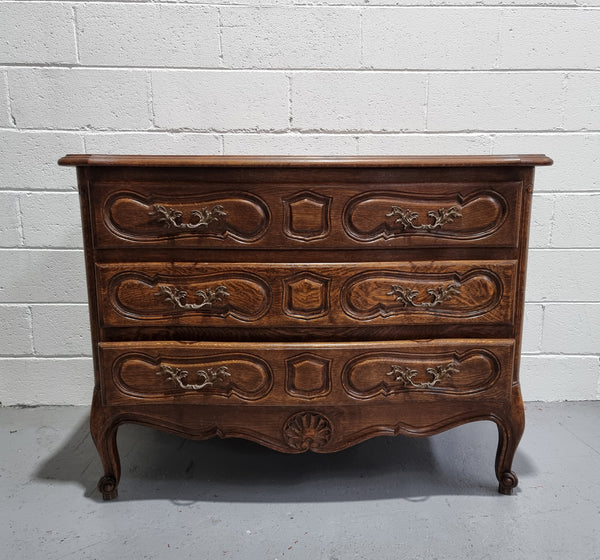 Lovely French nicely carved chest of 3 drawers with a parquetry top, with decorative handles and lovely carving. In good detailed condition.