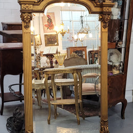 French Louis XVI style Napoleon III (1870’s) gilt mantle mirror. Beautifully carved and decorated with original bevelled mirror showing signs of age. It is in good original detailed condition and has been sourced from France.