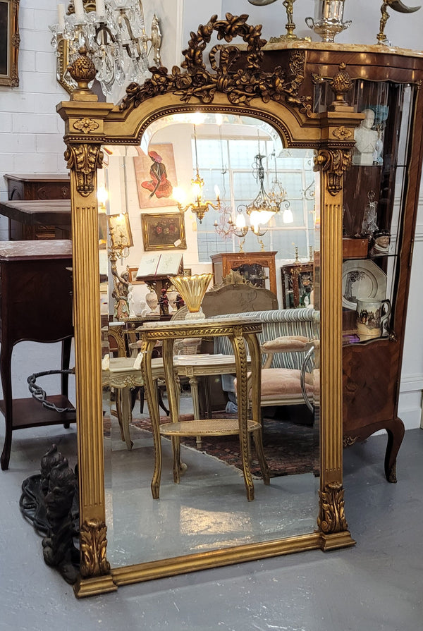 French Louis XVI style Napoleon III (1870’s) gilt mantle mirror. Beautifully carved and decorated with original bevelled mirror showing signs of age. It is in good original detailed condition and has been sourced from France.