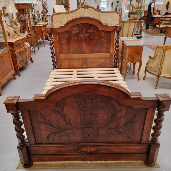 French 19th Century Walnut Henry II style queen sized bed with Barley Twist posts. Bed comes complete with custom made slats. Just place your mattress on top. In good original detailed condition.
