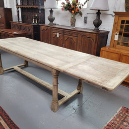 Beautilful raw solid oak French pedestal extension table. It has been sourced from France and is in good original detailed condition. When the table is fully extended it is 339 cm long and can comfortable seat 10-12 people. Features raw wood that could be used as is for a distressed look, or finished and waxed for a more refined look.