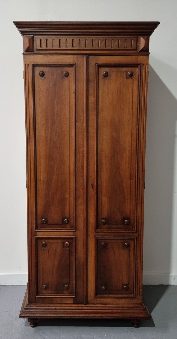 French Henry II style Walnut linen storage cupboard with nine pull out shelves. This piece could be very functional for a range of different purposes including shoe storage. It is in good original detailed condition, please note the door lock no longer functions and opens by pulling the door.