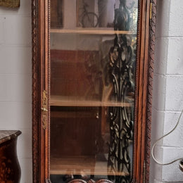 Petite oak armoire display cabinet with a glass door, two drawers at the bottom and three shelves inside. Late 18th Century and amazing detailed decorative carvings. Sourced from France and in good original condition.