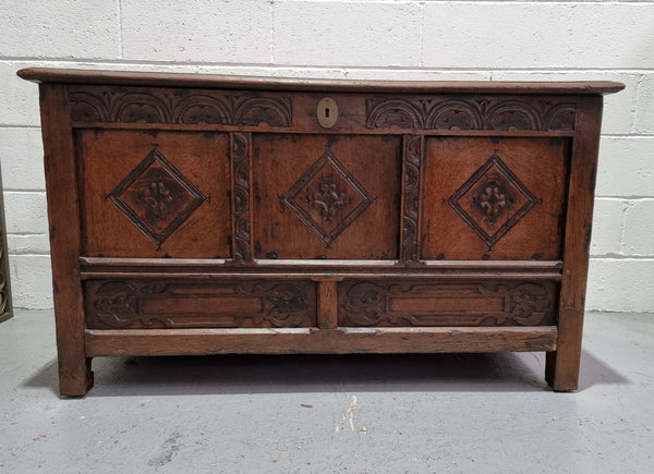 Early 19th Century French Oak carved coffer with a lift up lid for storage. A beautiful piece and in good original condition.