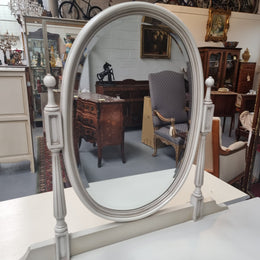French Louis XVI style painted dresser / console with beveled oval mirror and three drawers. Sourced from France and in good original detailed condition.