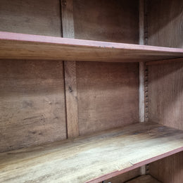 French light Oak two door bookcase with four adjustable shelves. It has beautiful decorative carving and is in good original detailed condition.