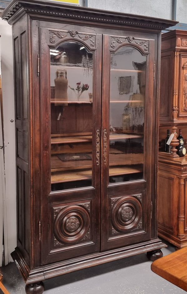 Substantial French Henry 2nd Walnut two door bookcase. It has five fully adjustable shelves and has been sourced from France. It is in good original detailed condition.
