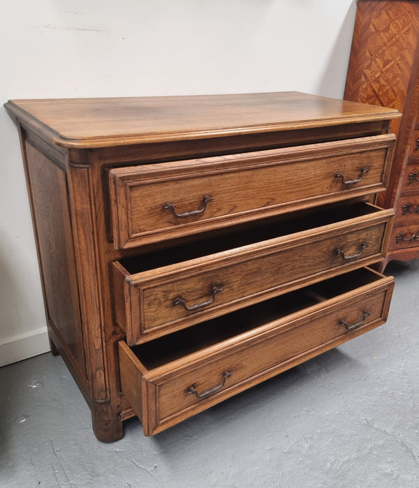 French solid Oak Louis 14th style chest of three drawers. It has three large spacious drawers and it has been sourced from France. It is in good original detailed condition.
