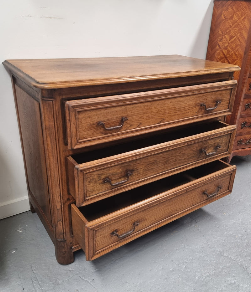 French solid Oak Louis 14th style chest of three drawers. It has three large spacious drawers and it has been sourced from France. It is in good original detailed condition.