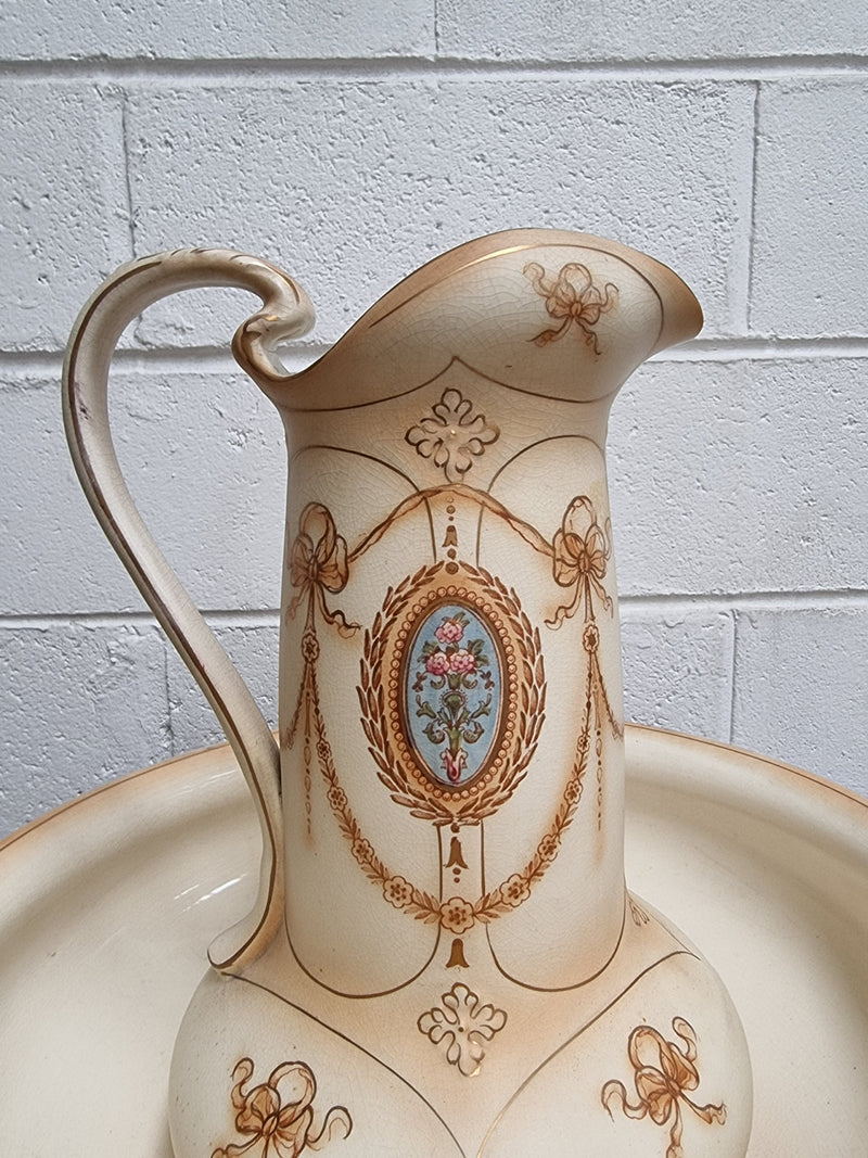 Charming large Crown Devon jug and basin set. Muted colors featuring garlands and floral medallions “Festoon Pattern” No chips or cracks in good condition commensurate with age