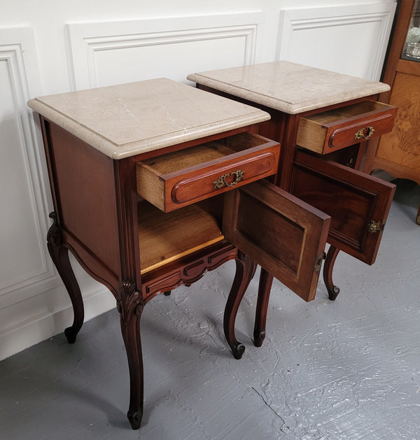 Pair of French Antiloopque Louis XV style Walnut and marble top bedsides. They have lovely carvings along with a drawer and cupboard space. They are in good original detailed condition and have been sourced from France