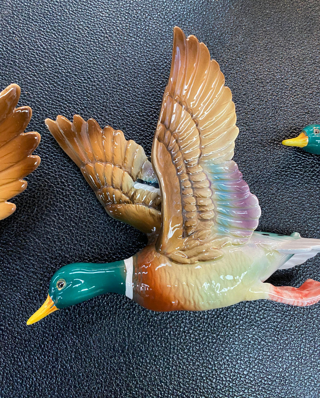 Set of three vintage flying duck wall ornaments. Measurements are for largest duck.