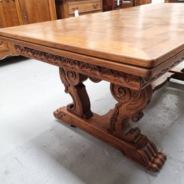 Amazing French Oak Renaissance style parquetry top extension table. Beautiful parquetry top and amazing detailed carvings on the legs. It extends to 306 cm long when fully extended. Sourced from France and in good original detailed condition.