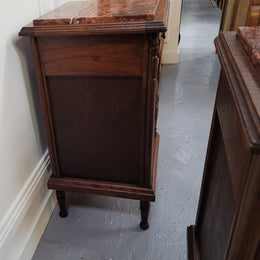 Pair of French Art Deco Oak and rouge inset marble top bedside cabinets. They have one drawer and one cupboard with elegant carving on the door. They have been sourced from France and are in good original detailed condition.
