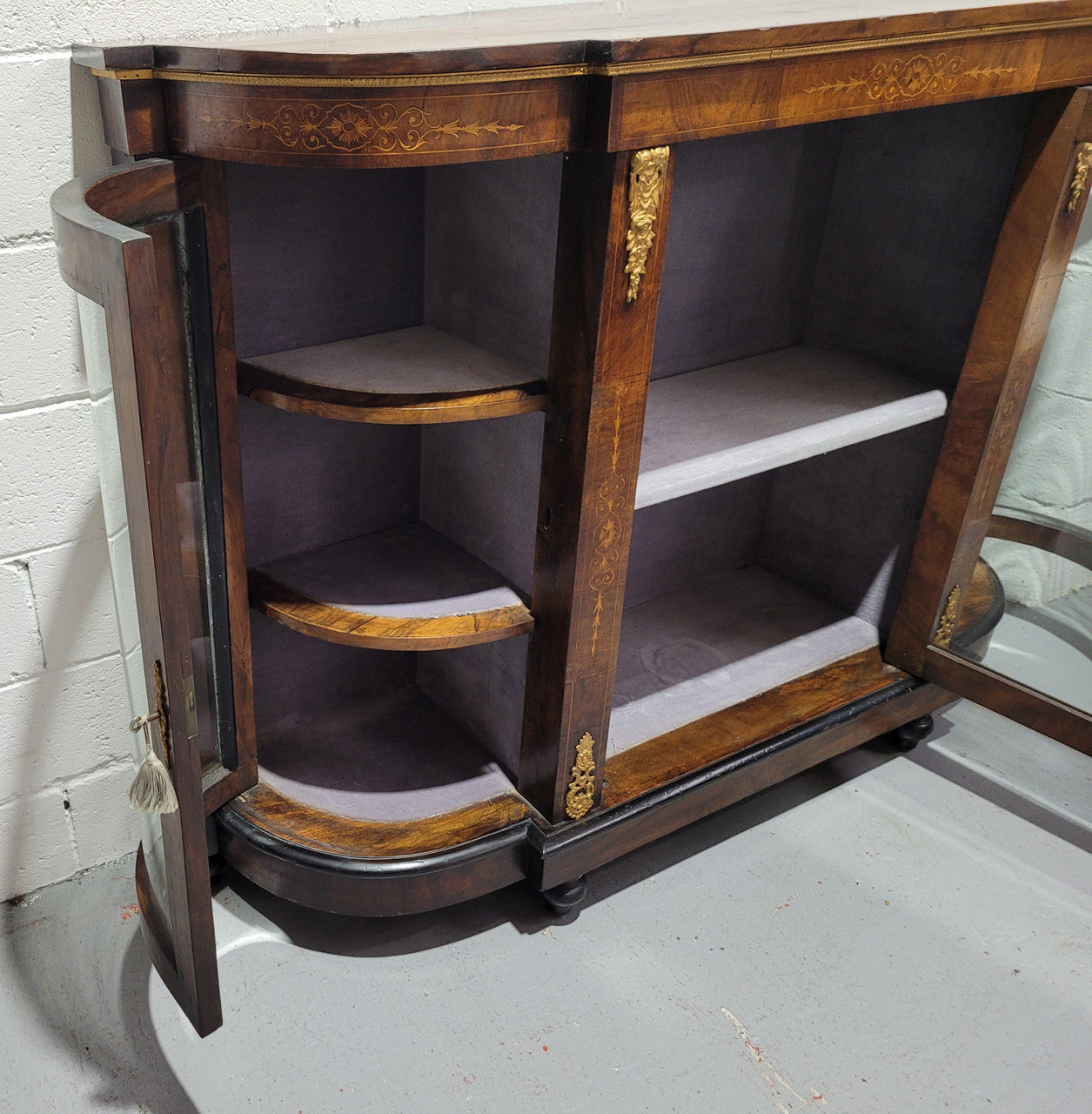 Victorian Rosewood inlaid side cabinet/credenza with velvet lined shelves and gilt mounts. It has been sourced locally and is in good original condition with loads of character.