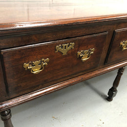 Early 19th Century English Oak dresser base with three large drawers. In very good original detailed condition.