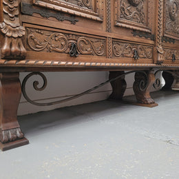 Large French Oak Renaissance style four door sideboard/buffet. Great decorative item with amazing carvings and stunning iron work on base. It is in good original detailed condition. Can pull apart completely making it easier to move.