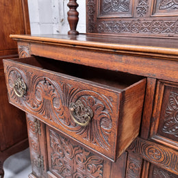 Impressively carved 18th Century English Oak kitchen dresser in 17th Century Jacobean style. It is in good original detailed condition and has been sourced from France.