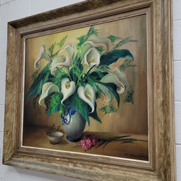 Signed and sourced in France a vintage oil on board still life of white lillie's in vase. In a beauitufl frame and it is in good original detailed condition.