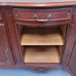 French Oak Louis XV style three drawer three door parquetry top sideboard. It has been sourced from France and is in good original detailed condition.