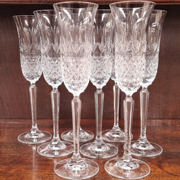 Set of eight crystal champagne glasses. In good original condition.