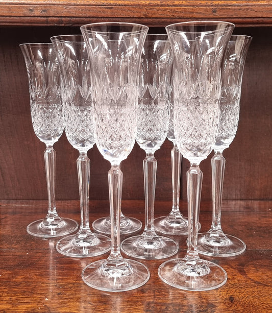Set of eight crystal champagne glasses. In good original condition.