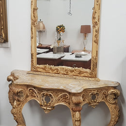 Beautifully carved Italian Rococo style painted console/hall table and mirror. An amazing coloured marble top showing sections of gold veins and is in good condition. Mantle mirror is retaining it's original mirror and showing ages spots.