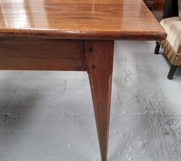 Antique French Oak Farmhouse table in fully restored condition. Features a single drawer and tapered legs.