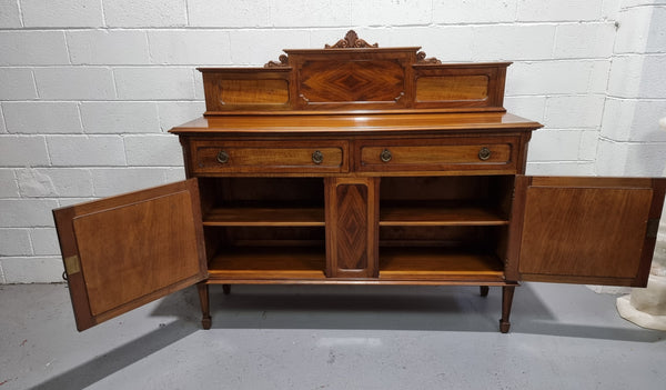 Fabulous Antique two door Blackwood and Fiddleback sideboard with lovely presence and also plenty of room for storage. In original detailed condition.