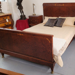 French Art Deco bedroom suite consisting of queen size bed in Amboyna wood and featuring pretty inlay. It comes with a matching pair of bedsides. It is a very stylish and high quality suite. It has been sourced from France and is in good original detailed condition.