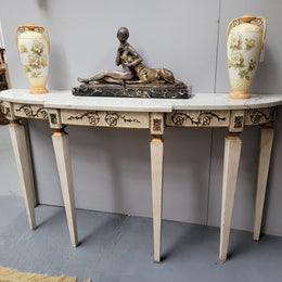 French Louis XVI style painted marble top console table. It is of pleasing narrow proportions and has been sourced from France. It is in good original detailed condition.