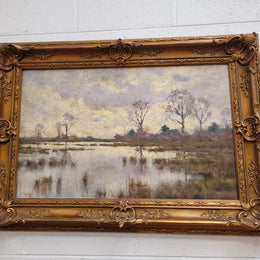 Sourced from France an impressionist oil painting of a beautiful lake scene. It is nicely framed in an Antique frame and in good original detailed condition.