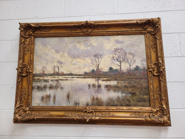Sourced from France an impressionist oil painting of a beautiful lake scene. It is nicely framed in an Antique frame and in good original detailed condition.